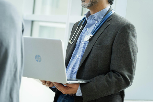 Doctor Holding Laptop